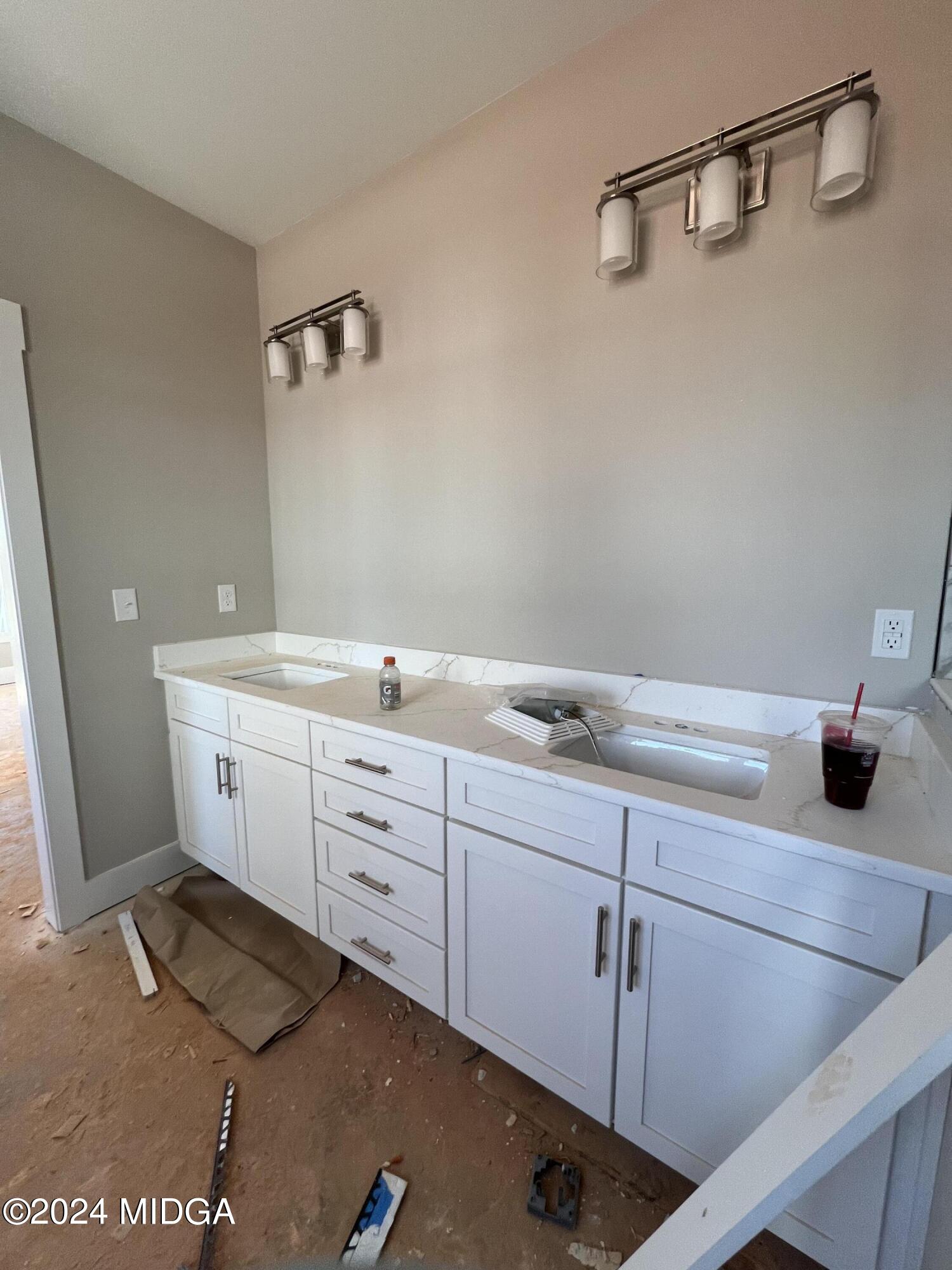 208 Copper Crossing Forsyth, GA 31029 - Photo 20 of 23 a spacious bathroom with a sink and mirror