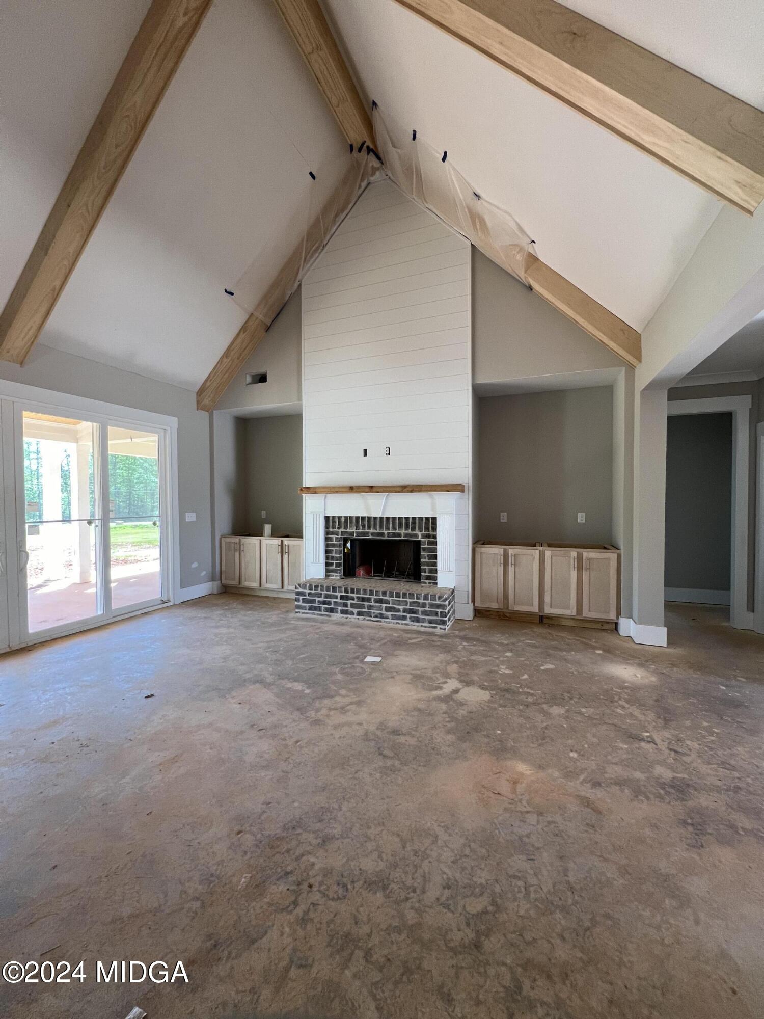208 Copper Crossing Forsyth, GA 31029 - Photo 10 of 23 a view of empty room with a fireplace