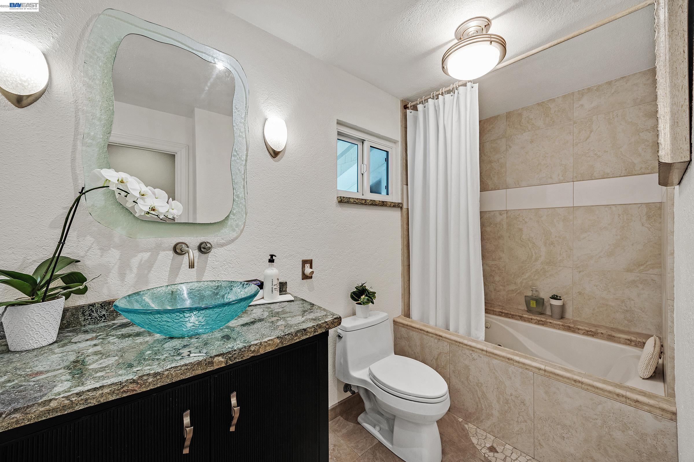 17 Suva Court San Ramon, CA 94582 - Photo 24 of 47 a bathroom with a granite countertop sink toilet and shower