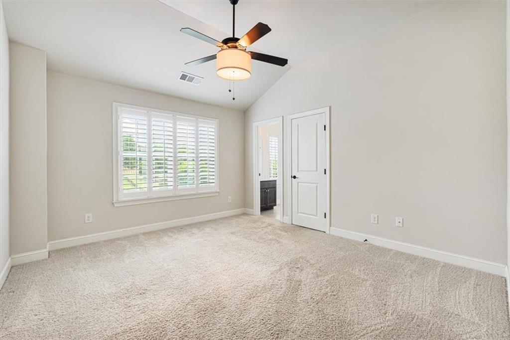 947 Hunter Way Milton, GA 30004 - Photo 60 of 78 an empty room with chandelier fan and windows