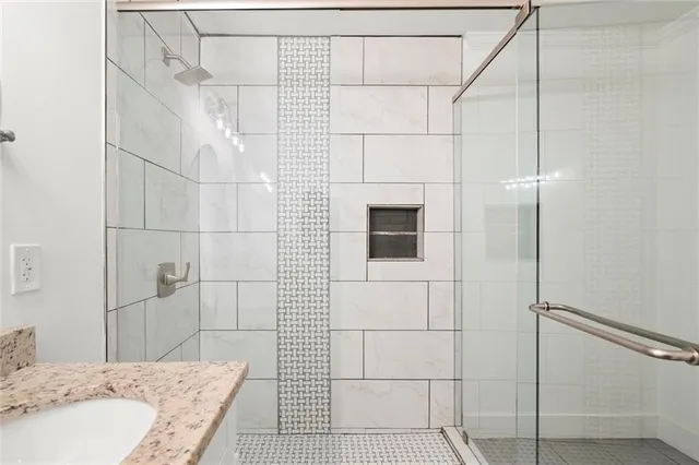 a bathroom with a sink and shower