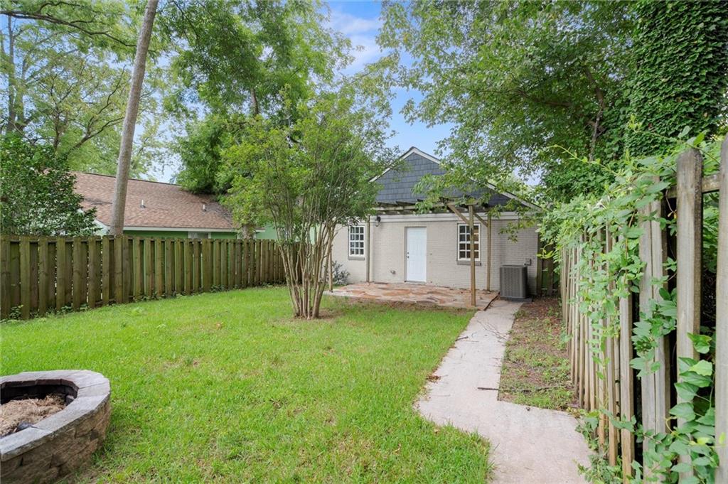 481 Griffin Street Northwest Atlanta, GA 30318 - Photo 24 of 30 a front view of a house with a yard and trees