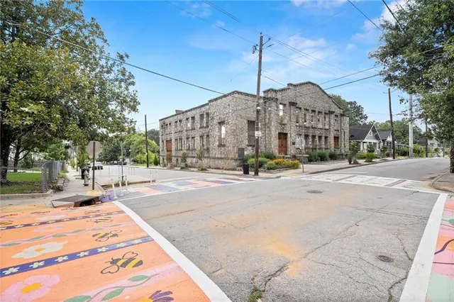 a view of a building with a street