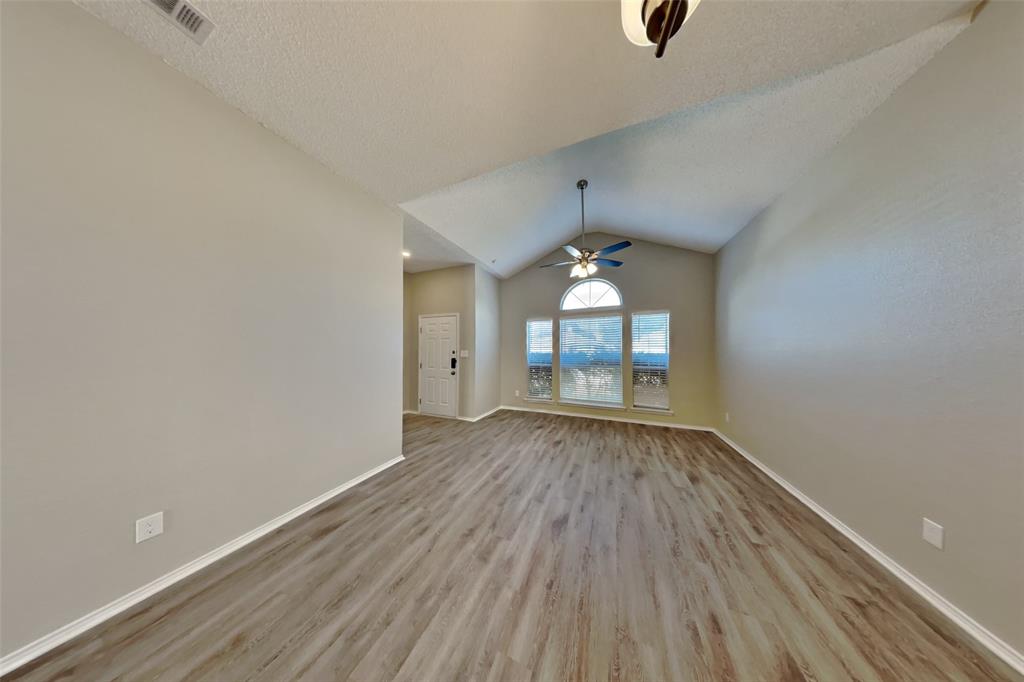 1924 Overland Street Fort Worth, TX 76131 - Photo 25 of 27 wooden floor in an empty room with a window