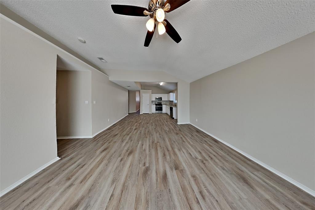 1924 Overland Street Fort Worth, TX 76131 - Photo 3 of 27 a view of empty room with wooden floor