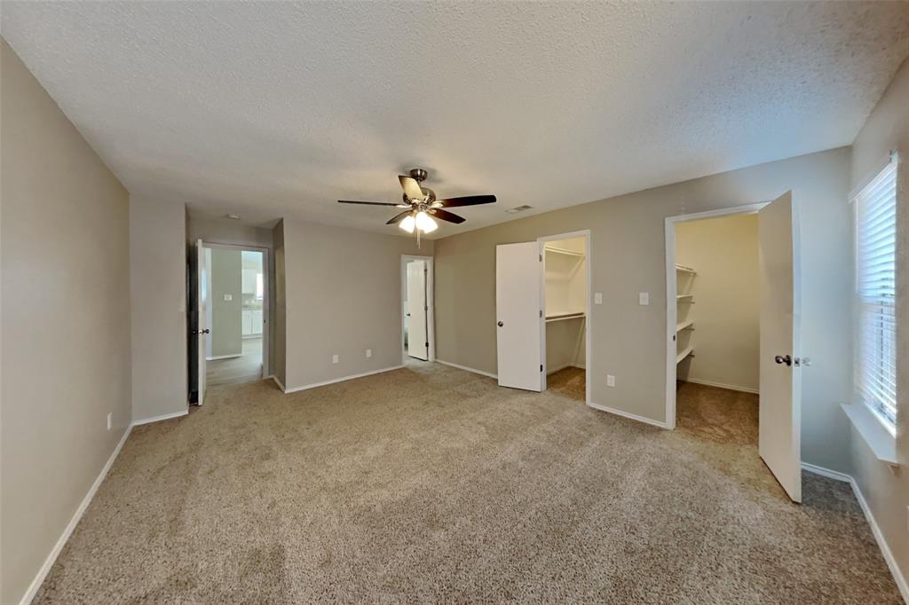 1924 Overland Street Fort Worth, TX 76131 - Photo 9 of 27 an empty room with fan and entrance