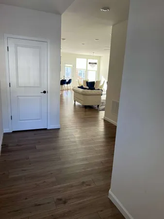 a view of a living room and hardwood floor