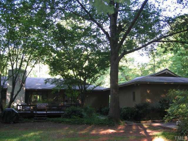 7229 Kemp Road Raleigh, NC 27613 - Photo 5 of 12 a front view of a house with a garden