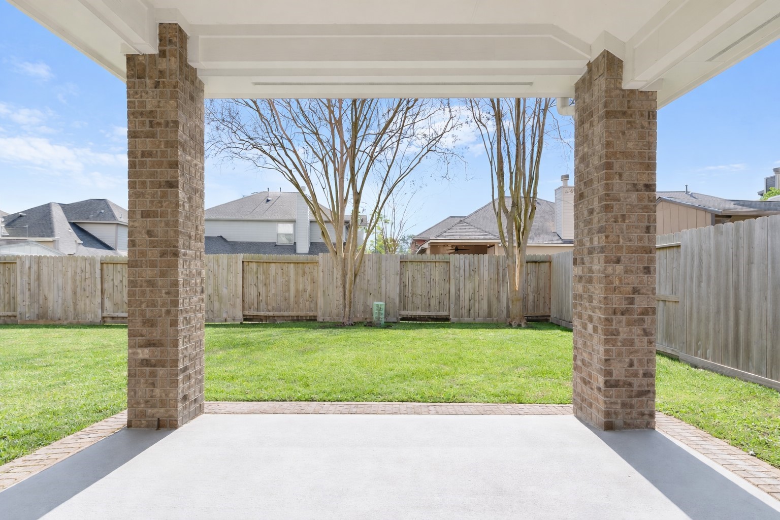 27515 Chris Ridge Court Spring, TX 77386 - Photo 26 of 29 The backyard is the perfect place to relax and eat al fresco on your oversized covered patio with beautiful brick columns. Imagine the crepe myrtles in full bloom!