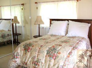 52901 Pine Cove Road, Unit 22 Idyllwild, CA 92549 - Photo 11 of 15 a bedroom with a bed and a mirror