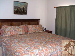 52901 Pine Cove Road, Unit 22 Idyllwild, CA 92549 - Photo 13 of 15 a large bed sitting in a bedroom next to a cabinet