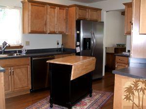 52901 Pine Cove Road, Unit 22 Idyllwild, CA 92549 - Photo 8 of 15 a kitchen with stainless steel appliances granite countertop a refrigerator and a stove