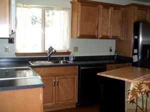 52901 Pine Cove Road, Unit 22 Idyllwild, CA 92549 - Photo 10 of 15 a kitchen with a sink and a refrigerator
