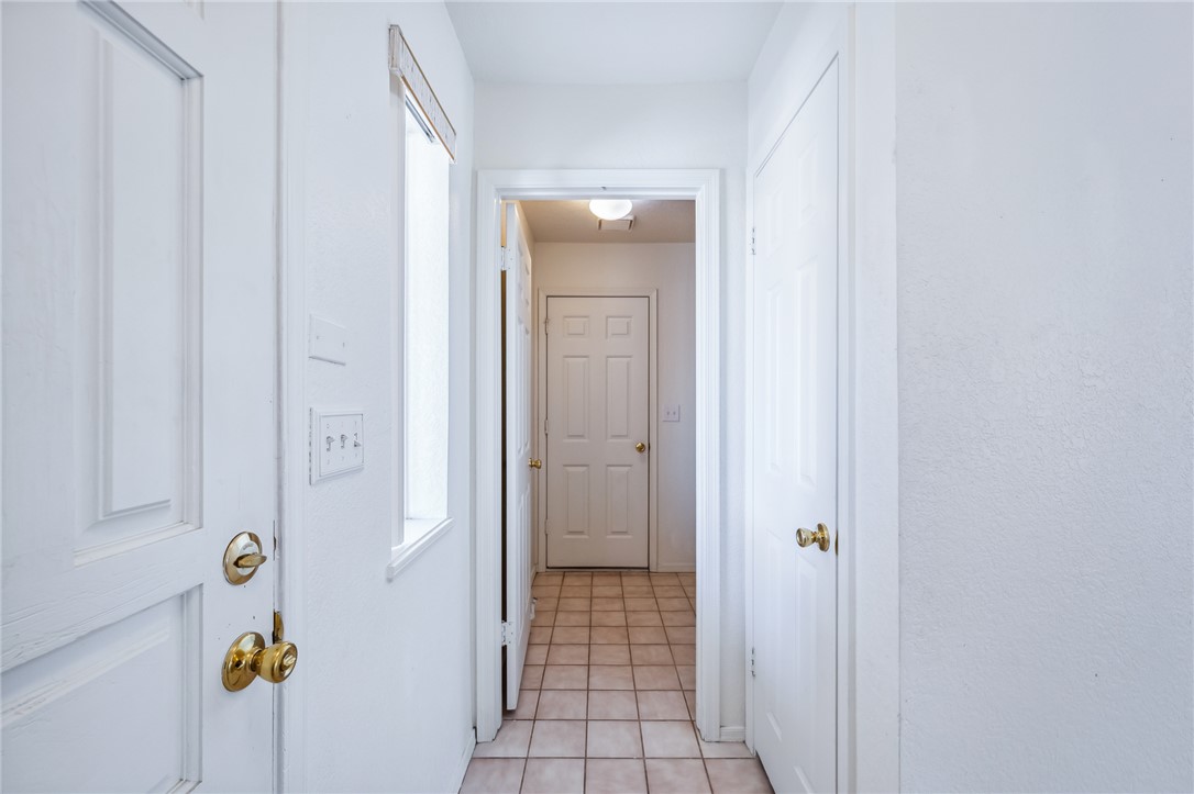 2524 South Ridge Avenue Bullhead City, AZ 86429 - Photo 45 of 64 Hallway featuring light tile patterned floors
