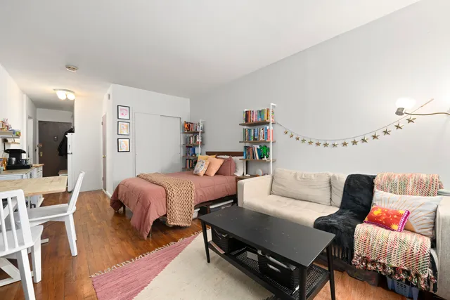 a bed room with bed and a couch