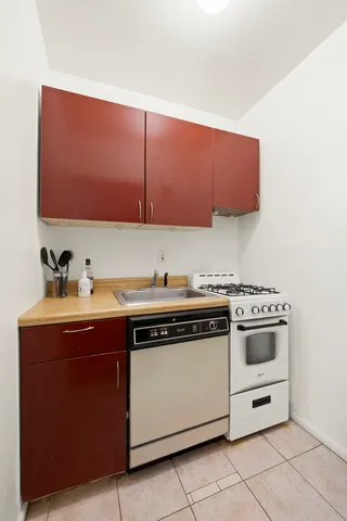 a kitchen with a stove and a sink