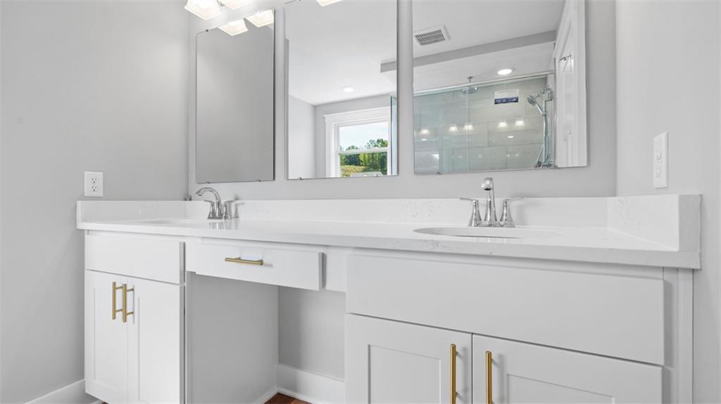 264 Rylie Drive Harmony, PA 16037 - Photo 21 of 31 a bathroom with a sink and a mirror