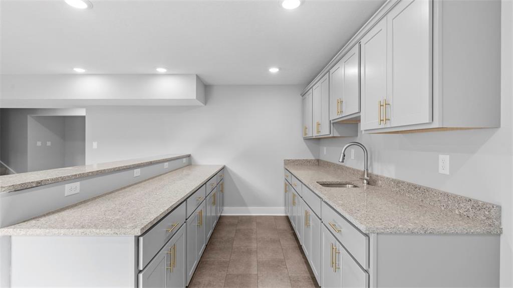 264 Rylie Drive Harmony, PA 16037 - Photo 27 of 31 a kitchen with a sink stove and cabinets