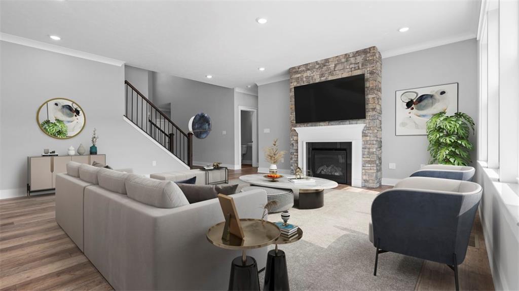 264 Rylie Drive Harmony, PA 16037 - Photo 4 of 31 a living room with furniture a flat screen tv and a fireplace