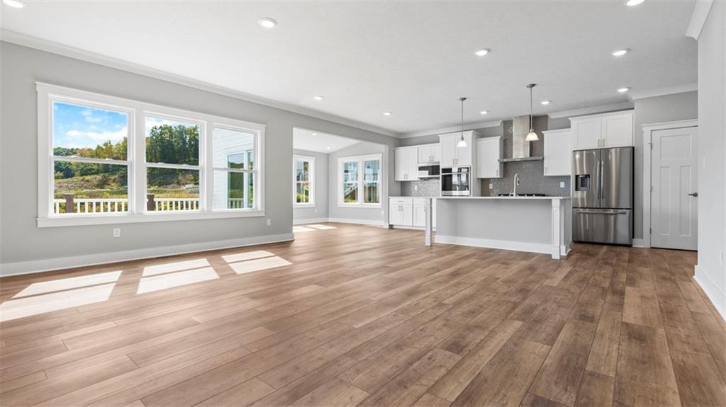 264 Rylie Drive Harmony, PA 16037 - Photo 8 of 31 a view of a kitchen with stainless steel appliances refrigerator stove and wooden floor