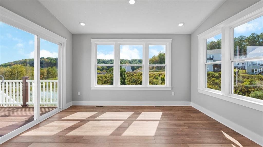264 Rylie Drive Harmony, PA 16037 - Photo 9 of 31 a view of an empty room with wooden floor and a window