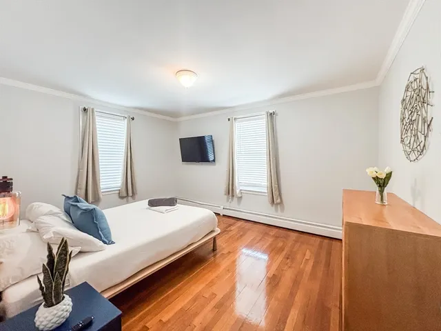 a bedroom with a bed and a table in it