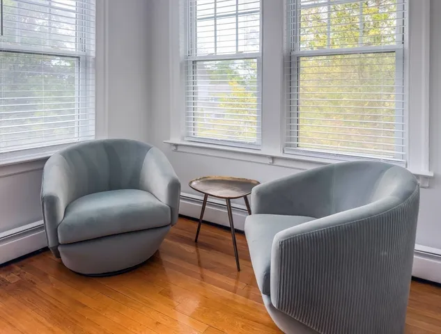 a living room with furniture and a window
