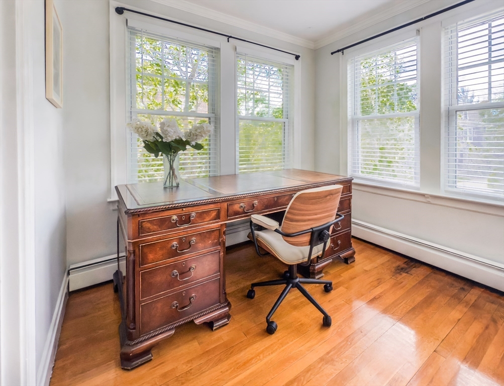 65-67 St James Circle, Unit 2 Newton, MA 02458 - Photo 7 of 29 a living room with furniture and a window
