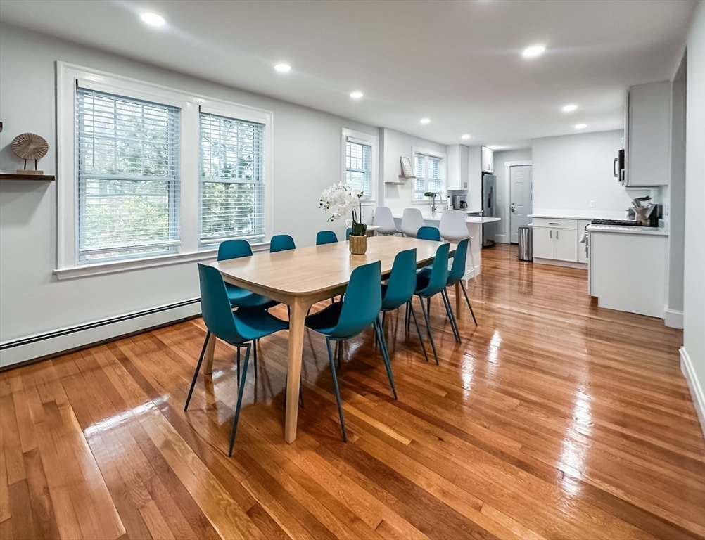 65-67 St James Circle, Unit 2 Newton, MA 02458 - Photo 9 of 29 a view of a dining room with furniture window and wooden floor