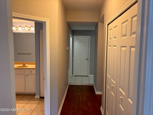 a view of a bathroom from a corridor