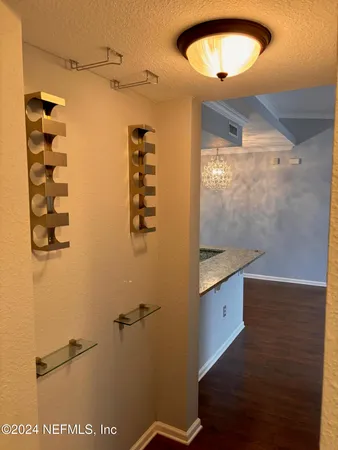 a bathroom with a granite countertop sink mirror and vanity