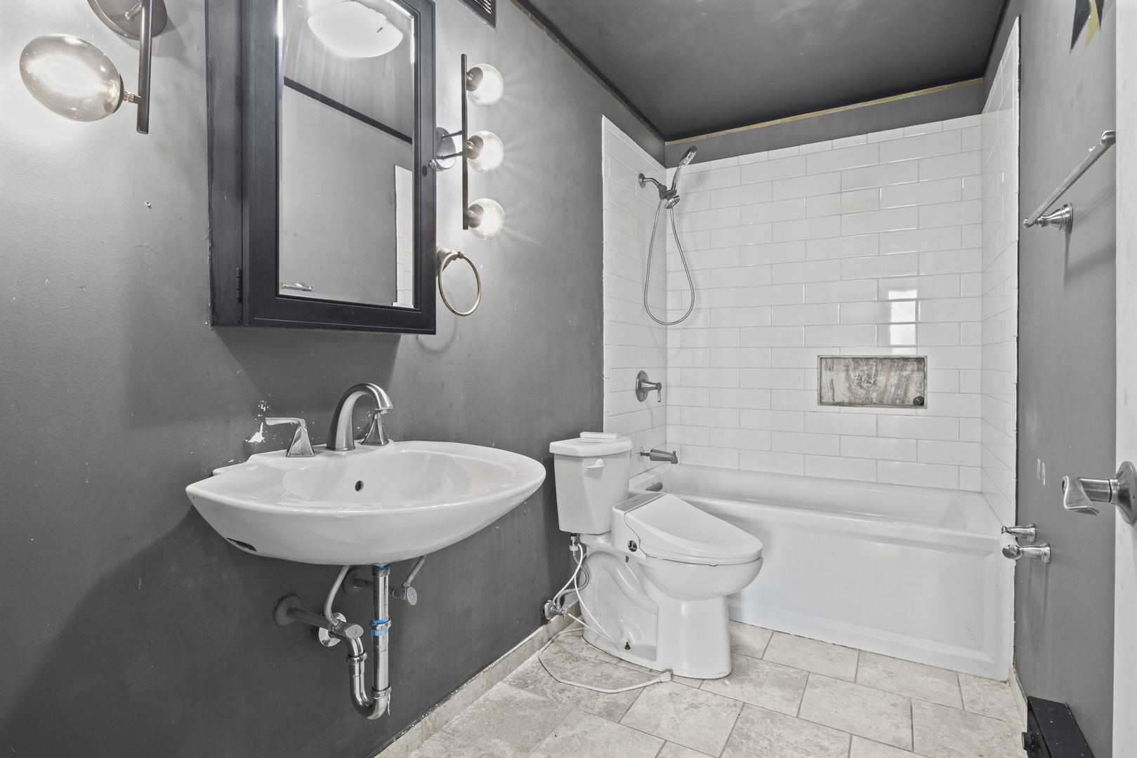 6033 North Sheridan Road, Unit 10D Chicago, IL 60660 - Photo 16 of 24 a bathroom with a sink toilet and a mirror