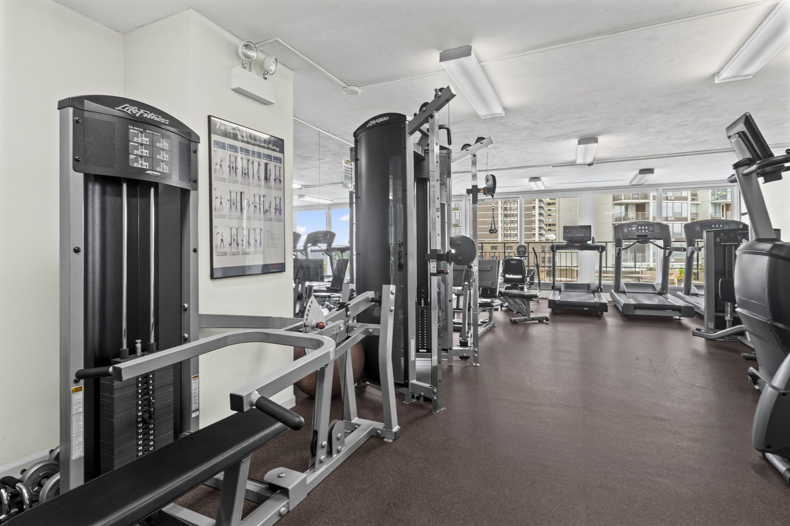 6033 North Sheridan Road, Unit 10D Chicago, IL 60660 - Photo 23 of 24 a view of a room with gym equipment