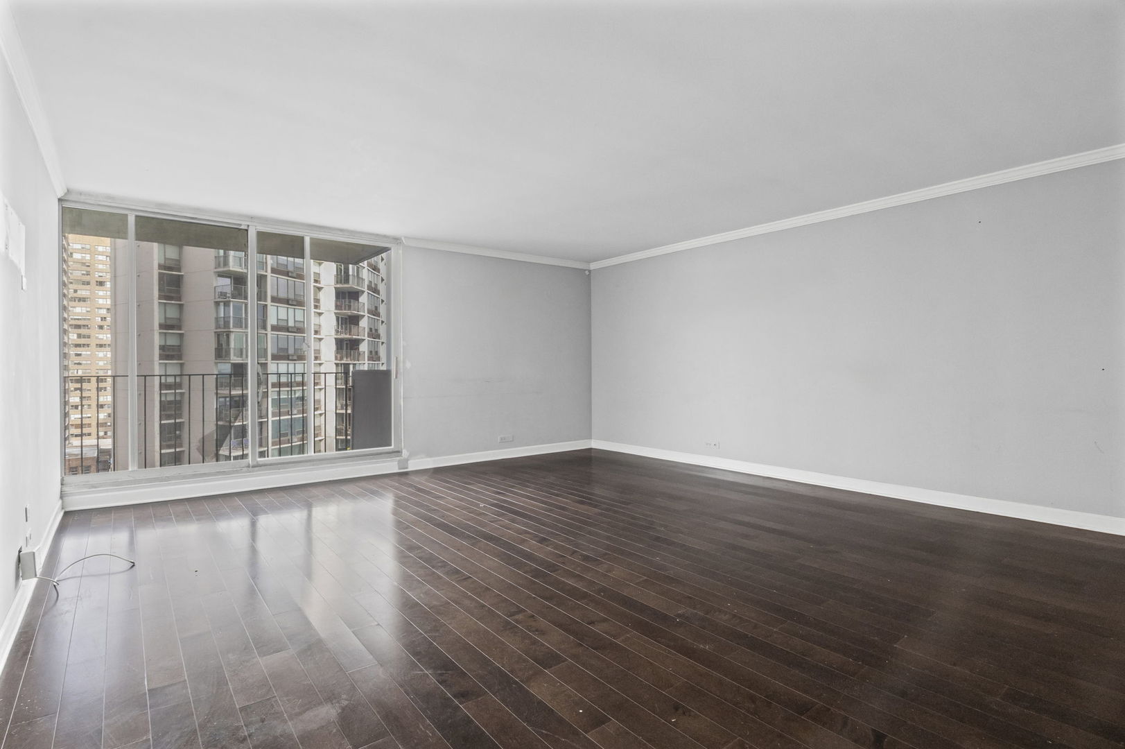 6033 North Sheridan Road, Unit 10D Chicago, IL 60660 - Photo 5 of 24 a view of wooden floor and windows in a room