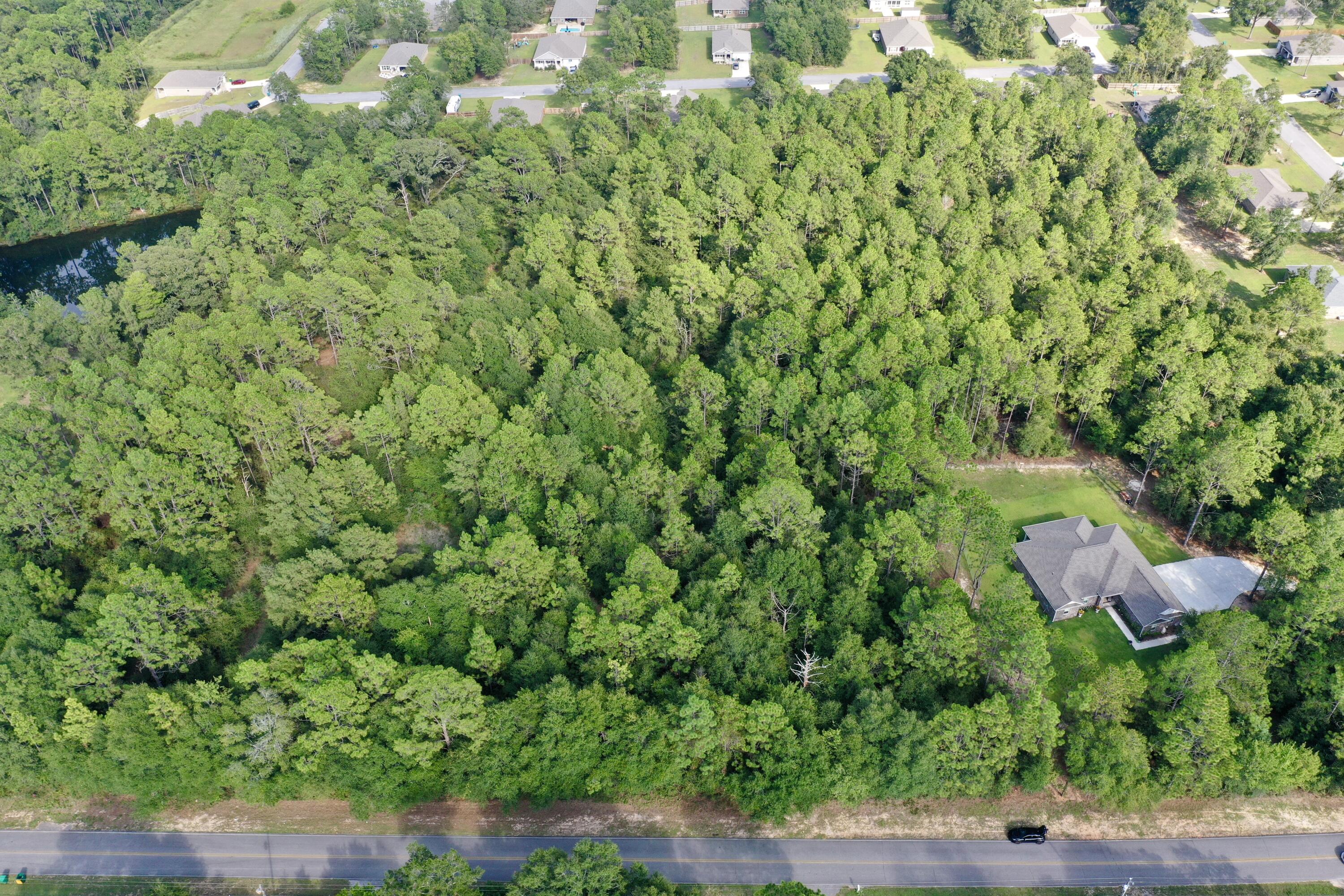 0 Possum Ridge Road Crestview, FL 32539 - Photo 8 of 10 an aerial view of residential house with outdoor space and trees all around