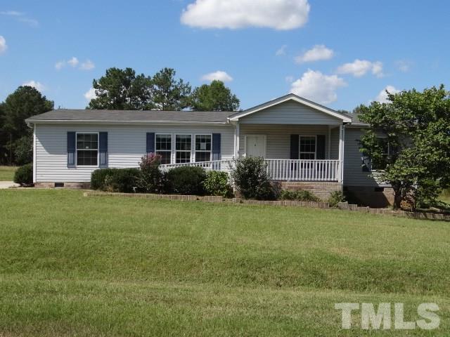 15 Beaver Run Road Spring Hope, NC 27882 - Photo 1 of 12 a front view of house with yard and green space