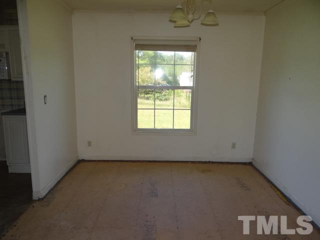 15 Beaver Run Road Spring Hope, NC 27882 - Photo 3 of 12 an empty room with a window