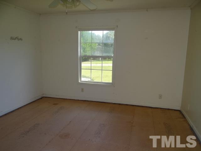 15 Beaver Run Road Spring Hope, NC 27882 - Photo 5 of 12 an empty room with a window