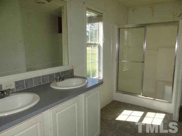 15 Beaver Run Road Spring Hope, NC 27882 - Photo 6 of 12 a bathroom with a sink and a mirror