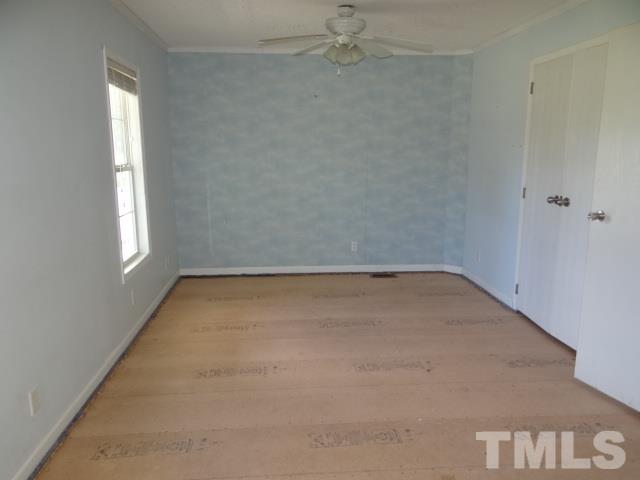 15 Beaver Run Road Spring Hope, NC 27882 - Photo 7 of 12 an empty room with a window