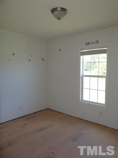 15 Beaver Run Road Spring Hope, NC 27882 - Photo 10 of 12 an empty room with a window