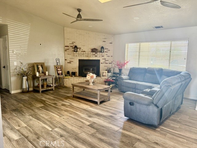 13375 Rincon Road Apple Valley, CA 92308 - Photo 11 of 72 a living room with furniture and a fireplace
