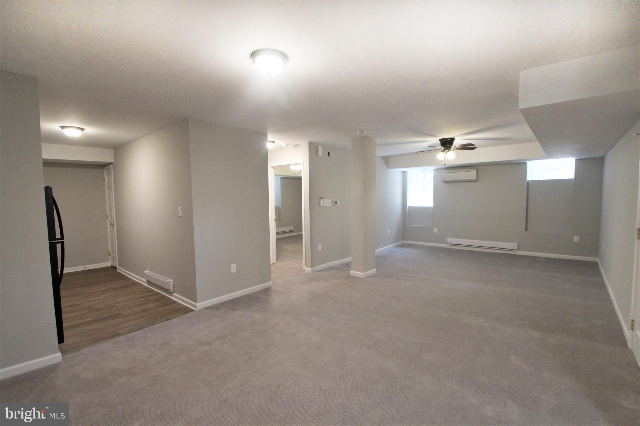 6640 Sprague Street, Unit B5 Philadelphia, PA 19119 - Photo 6 of 16 an empty room with entrance and windows