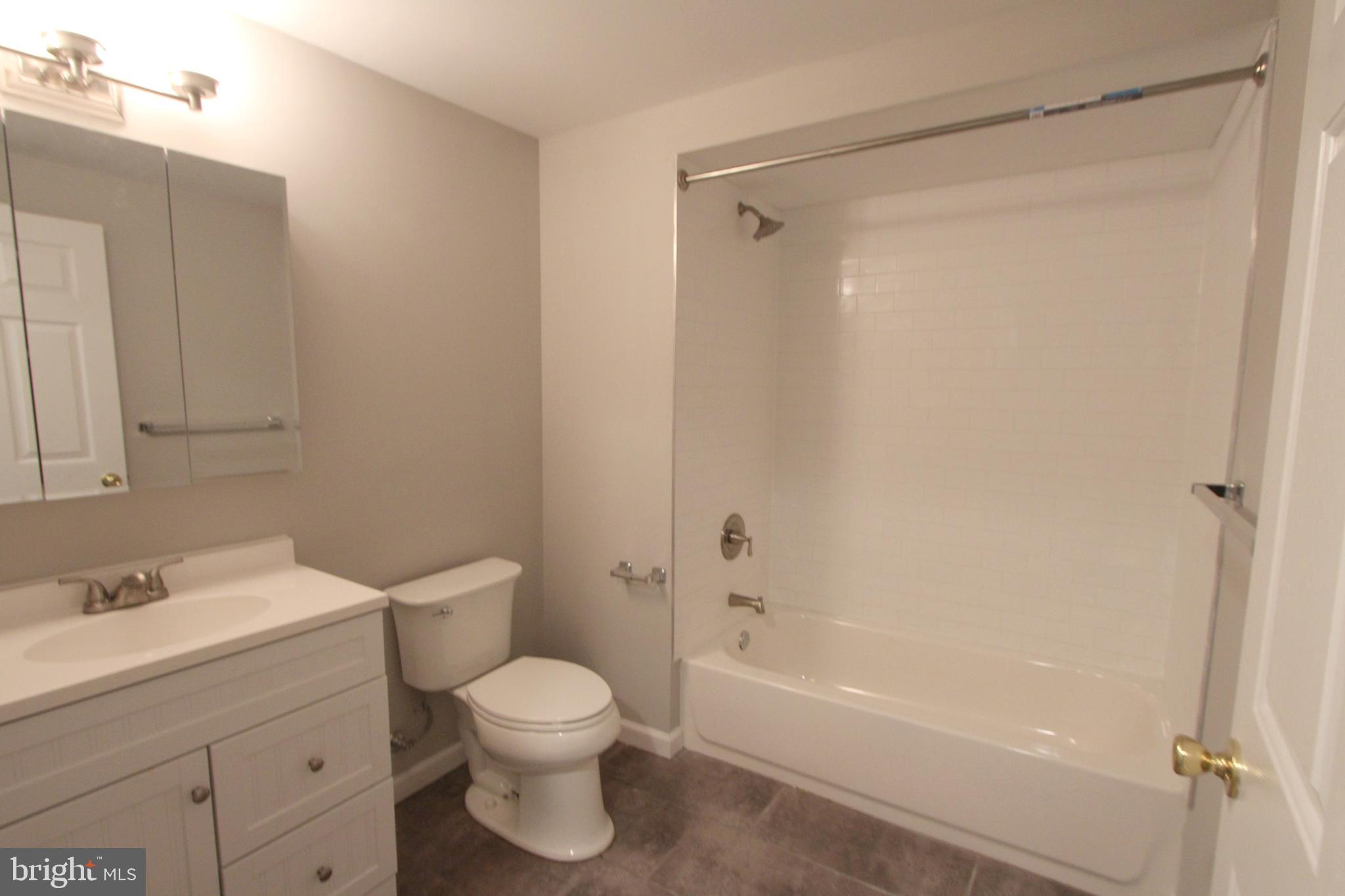 6640 Sprague Street, Unit B5 Philadelphia, PA 19119 - Photo 8 of 16 a bathroom with a toilet sink and shower
