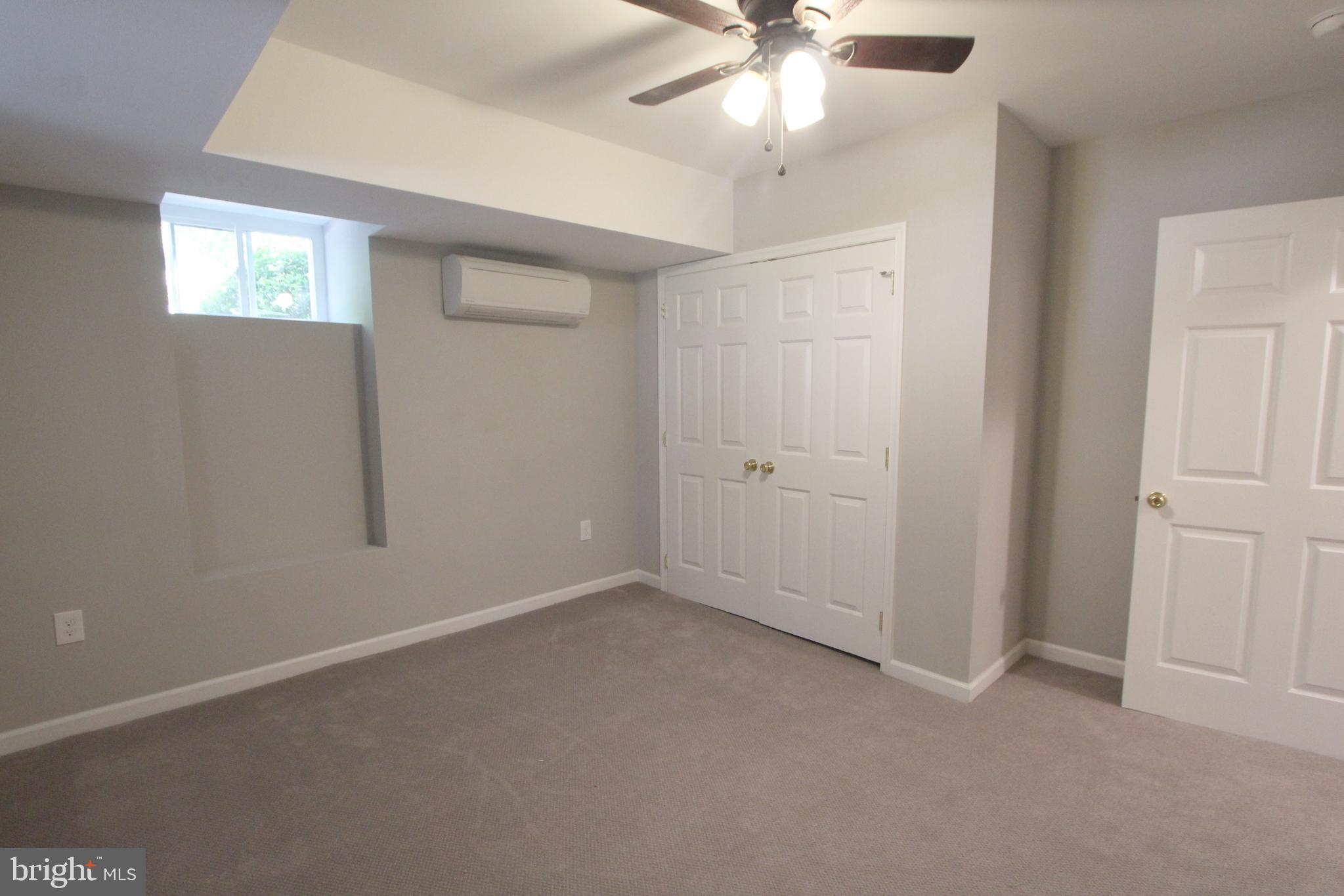 6640 Sprague Street, Unit B5 Philadelphia, PA 19119 - Photo 10 of 16 an empty room with a fan & a window