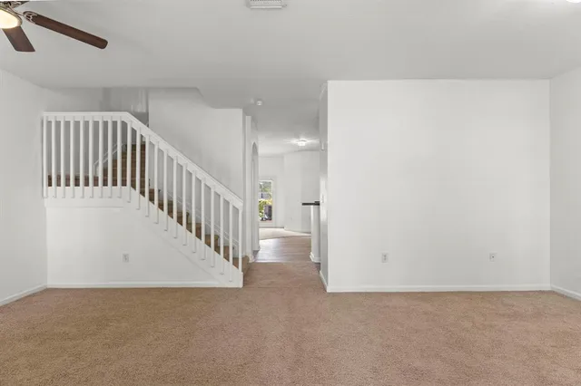 a view of a hallway with staircase