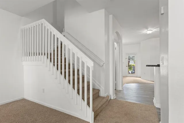 a kitchen with a refrigerator a microwave and sink