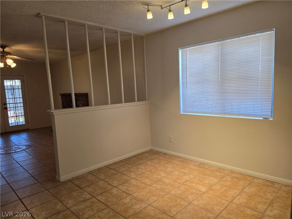 5289 Reeder Circle Las Vegas, NV 89119 - Photo 10 of 40 Durable tile flooring and a distinctive architectural divider define this versatile dining space.