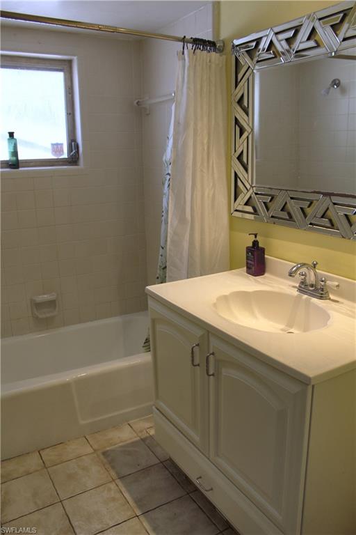 7328 Pebble Beach Road Fort Myers, FL 33967 - Photo 20 of 31 a bathroom with a sink and a mirror