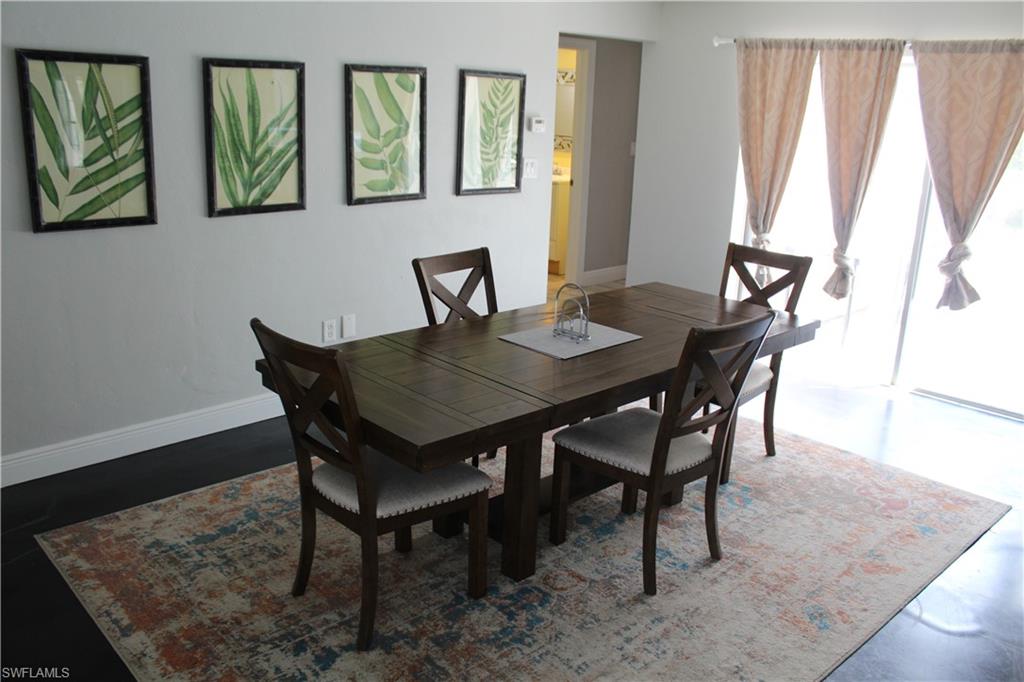 7328 Pebble Beach Road Fort Myers, FL 33967 - Photo 25 of 31 a view of a dining room with furniture